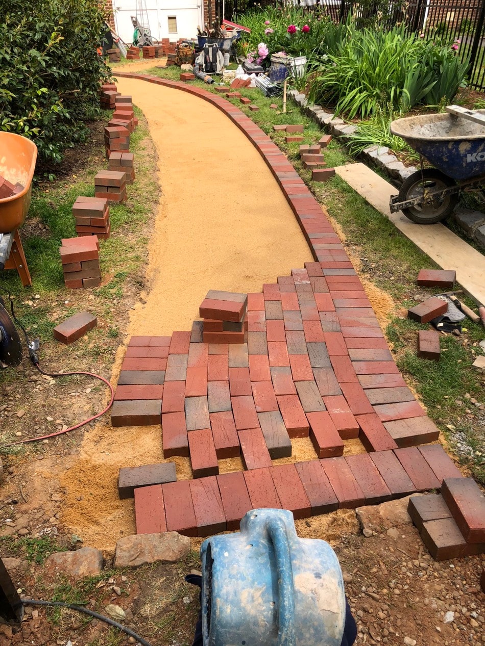Curved brick walkway being laid