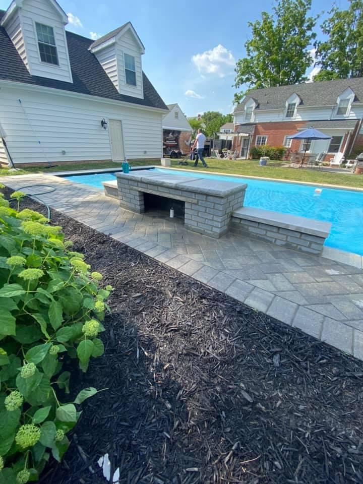 Pool patio with brick seating wall