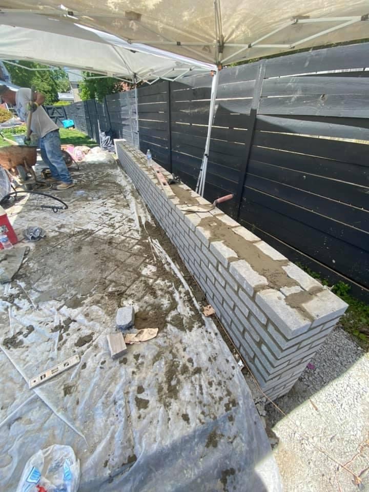 Brick seating wall under construction